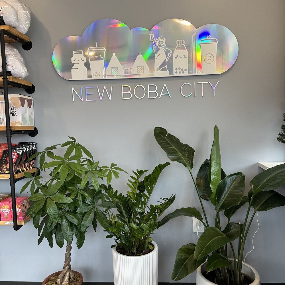 Yaya Tea - Hicksville - two potted plants in front of a new boba city sign - Bubble Tea Near Me - Hicksville, New York Yaya Tea - Hicksville - two potted plants in front of a new boba city sign - Bubble Tea Near Me - Hicksville, New York