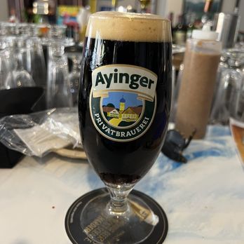 Hofbrau Amelia - a glass of beer on a table - German Near Me - Fernandina Beach, Florida Hofbrau Amelia - a glass of beer on a table - German Near Me - Fernandina Beach, Florida