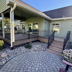 Custom Decks - New deck with TimberTech Antique Leather decking, Dark Roast picture frame boards, and black Westbury Riviera railing.