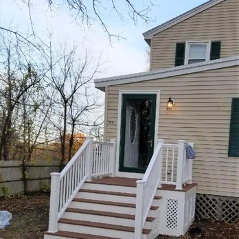 Skillville Corp - New deck with PVC deck boards and handrails. PVC trim to finish area below deck in Billerica, MA - General Contractors Near Me - Methuen, Massachusetts