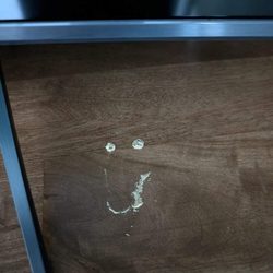 Ashley Store - Not a smiley face, those dust mounds are the bugs coming out of the furniture.