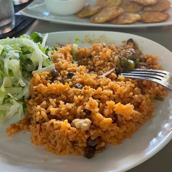 The Empanada Lady - My plate, Pastele stew was in a separate bowl. Tostones in the background - Caribbean Near Me - Wailuku, Hawaii The Empanada Lady - My plate, Pastele stew was in a separate bowl. Tostones in the background - Caribbean Near Me - Wailuku, Hawaii