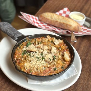 Tilikum Place Cafe - Eggs in Purgatory-Baked Eggs 2/2/25: Tomato, garlic, onion, gruyere, chili flakes, rosemary, parmesan pan de mie - New American Near Me - Seattle, Washington Tilikum Place Cafe - Eggs in Purgatory-Baked Eggs 2/2/25: Tomato, garlic, onion, gruyere, chili flakes, rosemary, parmesan pan de mie - New American Near Me - Seattle, Washington