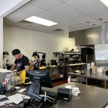 I like Sushi - a man working in a restaurant kitchen - Sushi Bars Near Me - Middleton, Wisconsin
