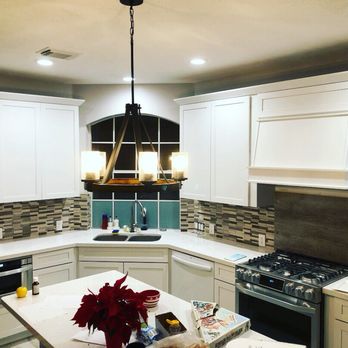 A2A corporation - a kitchen with white cabinets and white countertops - General Contractors Near Me A2A corporation - a kitchen with white cabinets and white countertops - General Contractors Near Me