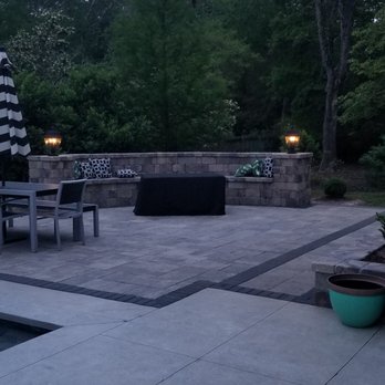 Aesthetic Landscapes - a patio with a table and chairs - Landscaping Near Me - Mandeville, Louisiana Aesthetic Landscapes - a patio with a table and chairs - Landscaping Near Me - Mandeville, Louisiana