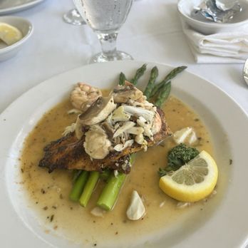 The Chimneys - Lunch special: blacken mahi mahi on a bed of asparagus with shrimp and crab meat topped with a mushroom butter sauce. It was only $16!!! - Cajun/Creole Near Me - Gulfport, Mississippi The Chimneys - Lunch special: blacken mahi mahi on a bed of asparagus with shrimp and crab meat topped with a mushroom butter sauce. It was only $16!!! - Cajun/Creole Near Me - Gulfport, Mississippi