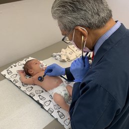 Dr. Edralin checking on our newborn Dr. Edralin checking on our newborn
