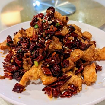 Earl Spicy - a plate of food on a table - Szechuan Near Me - Millbrae, California Earl Spicy - a plate of food on a table - Szechuan Near Me - Millbrae, California