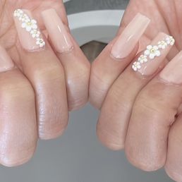 Gel X nails with flowers design