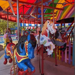 Pixieland Amusement Park - Superman and Batman horses with oldie sound effect style horse in the middle