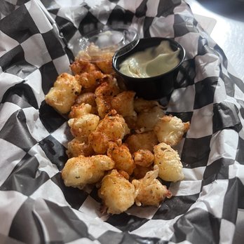 Stray Dog - Cheese curds. I can't remember the seasoning but overall really good the dip was very smooth - New American Near Me - Minneapolis, Minnesota