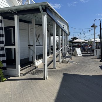 Water's Edge - Upper deck entrance from large parking lot with pay station spots - Seafood Near Me - Mount Pleasant, South Carolina