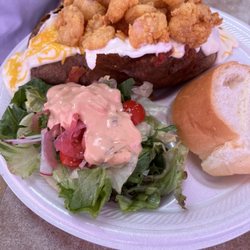 Lunch Box - Special- baked potato with fried shrimp, cheese sauce, sour cream, a side salad and bread