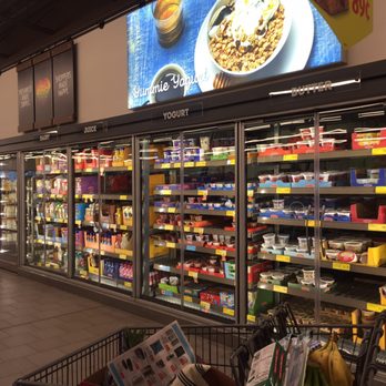 ALDI - Dairy section. Lightweight, all-glass doors have great visibility and easy access. Nice update! - Grocery Near Me - Wixom, Michigan