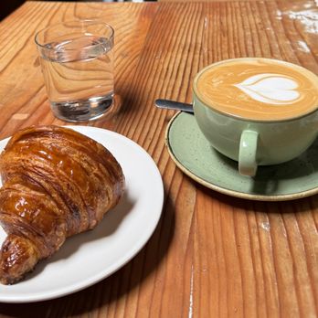 Sirene - Croissant, Latte, and nice water in a nice glass. - Seafood Near Me - Oakland, California Sirene - Croissant, Latte, and nice water in a nice glass. - Seafood Near Me - Oakland, California
