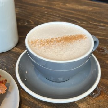 Archr - a cup of cappuccino and a plate of food - Coffee Roasteries Near Me - Langley Township, British Columbia Archr - a cup of cappuccino and a plate of food - Coffee Roasteries Near Me - Langley Township, British Columbia