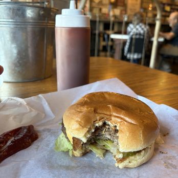 Grumps Burgers - Inside look after good size bite - Burgers Near Me - Burleson, Texas