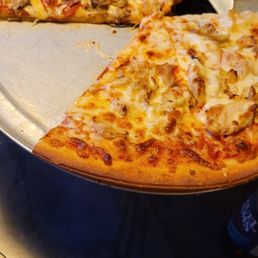 a pizza with a slice taken out of it