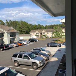 Ashton Cove Apartments - Parking lot view and units of the complex