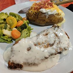 J&D’s Steakhouse - Chicken fried steak with roasted vegetables and fully loaded baked potato