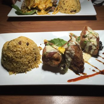 Platos - Chicken breast wrapped in bacon, stuffed with sweet plantains, seasoned rice. - Latin American Near Me - Carolina, Puerto Rico Platos - Chicken breast wrapped in bacon, stuffed with sweet plantains, seasoned rice. - Latin American Near Me - Carolina, Puerto Rico