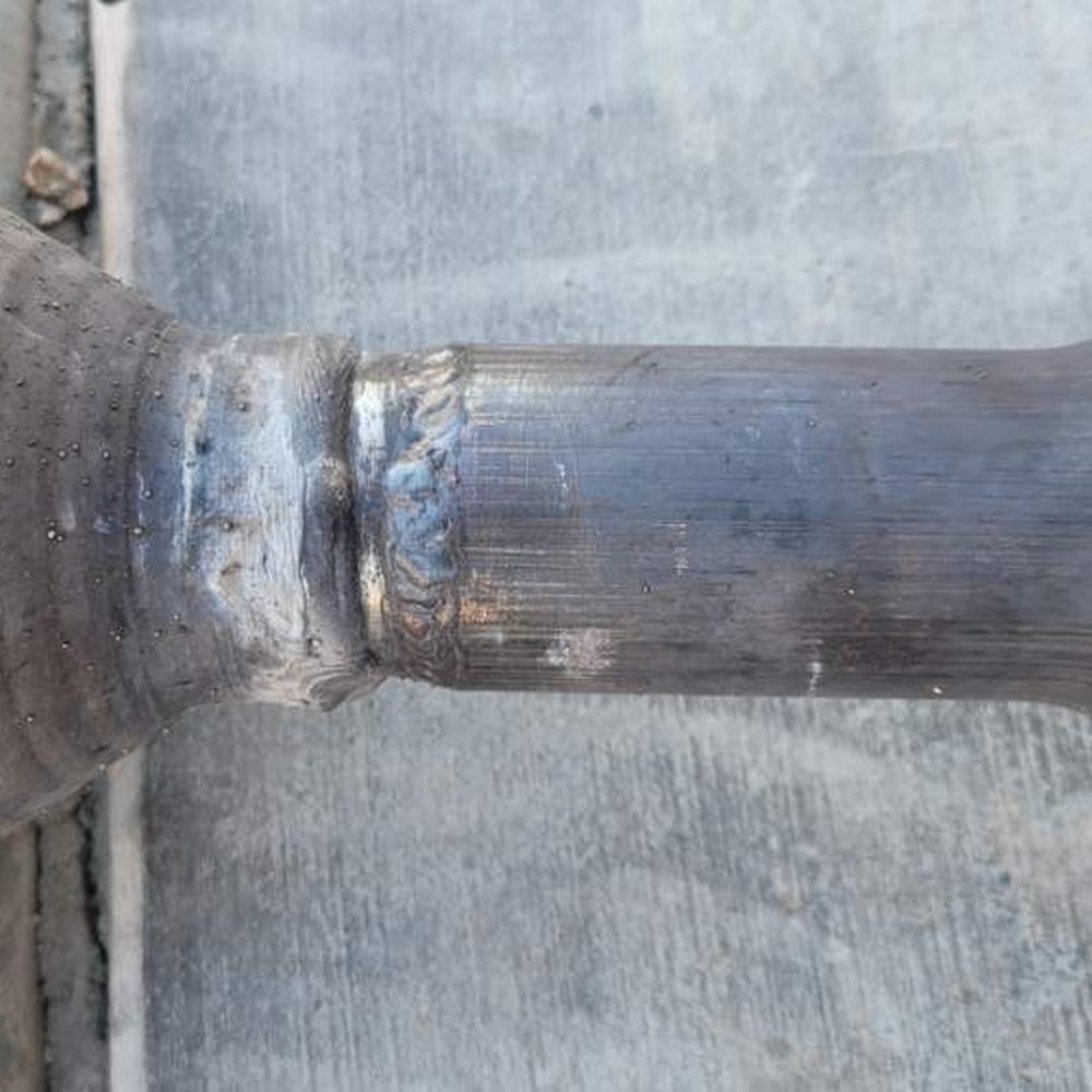 Garcia Welding - Finished weld of the catalytic converter to the exhaust pipe - Metal Fabricators Near Me Garcia Welding - Finished weld of the catalytic converter to the exhaust pipe - Metal Fabricators Near Me