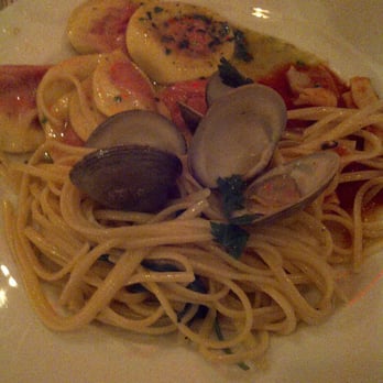 Becco - beet ravioli, tomato basil farfalle, and lingunie with garlic and clam sauce - Italian Near Me - New York, New York