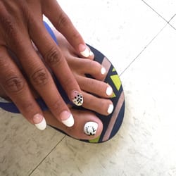 Best Nails - Toes: White gel polish with a flower. Hand: Oval shape French tip with a creative little flower on the ringer fingers