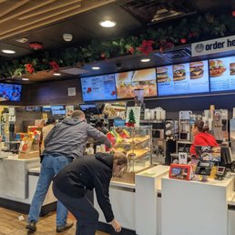 customers ordering food at the counter customers ordering food at the counter