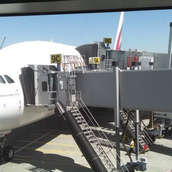 Emirates - 2 of 3 gate bridges attached to aircraft - Airlines Near Me - San Francisco, California Emirates - 2 of 3 gate bridges attached to aircraft - Airlines Near Me - San Francisco, California