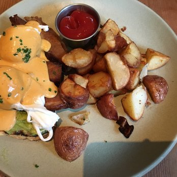 Finch & Fork - roasted pork belly + egg - poached eggs, smashed avocados, toasted bread topped with hollandaise sauce = $16 - New American Near Me - Santa Barbara, California