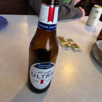 Glenwood Inn - a bottle of beer on a table - Bars Near Me - Glenwood, Indiana Glenwood Inn - a bottle of beer on a table - Bars Near Me - Glenwood, Indiana