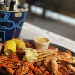 Beauxdines - $45.99 "The Trio": 3 lbs Crawfish, 1/2 lb Shrimp & Crab. $2 Dip. $.89 Extra Potato. $.89 Extra Corn. $1.99 Sausage (not pictured).