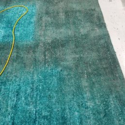 Before the rug was cleaned and treated