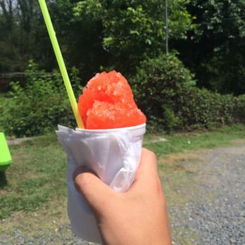 Cozy's Shaved Ice - a hand holding a cup of shaved ice - Desserts Near Me - North Little Rock, Arkansas Cozy's Shaved Ice - a hand holding a cup of shaved ice - Desserts Near Me - North Little Rock, Arkansas