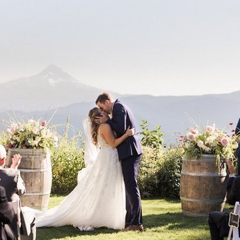 Gorge Crest Vineyards - a bride and groom kissing at the end of their wedding ceremony - Venues & Event Spaces Near Me - Underwood, Washington Gorge Crest Vineyards - a bride and groom kissing at the end of their wedding ceremony - Venues & Event Spaces Near Me - Underwood, Washington