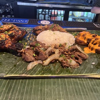Bonifacio - Selection of food served on banana leaves - Filipino Near Me - Columbus, Ohio Bonifacio - Selection of food served on banana leaves - Filipino Near Me - Columbus, Ohio