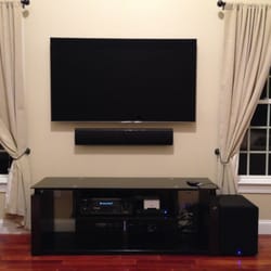 Securely Sound - TV mounted, speaker bar, subwoofer - they hid all the wires. Looks great!