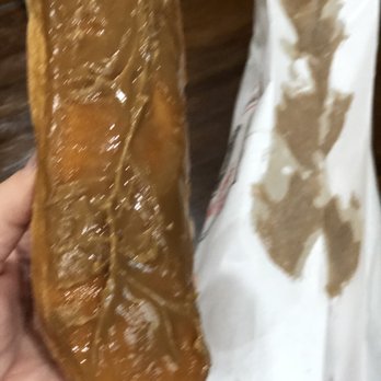 Ole Donut - Maple bar with half the maple still stuck to the bag. - Donuts Near Me - Lake Worth, Texas