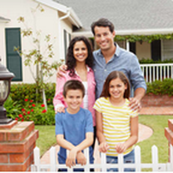 Airel Construction - a family in front of their home - General Contractors Near Me Airel Construction - a family in front of their home - General Contractors Near Me