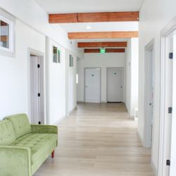 JB Psychological Services - Wide open lobby with offices for OT, speech, mental health, pediatrician, and testing for neurodivergence.