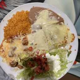 El Jefe burrito with rice and beans. All the sauce was on the left side as pictured.