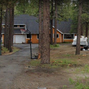 Grey Squirrel Resort & Vacation Rental Homes - The big cabin we stayed in (sleeps 14) w/debris, trash and unkept camper right in our view. Off to the side from the well kept cabins. - Big Bear Lake, CA