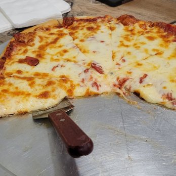 Mineos Pizza - a half eaten pizza on a pizza pan - Pizza Near Me - Hampton Township, Pennsylvania Mineos Pizza - a half eaten pizza on a pizza pan - Pizza Near Me - Hampton Township, Pennsylvania