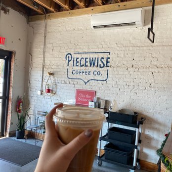 Piecewise Coffee - a person holding a cup of coffee - Coffee & Tea Near Me - Cayce, South Carolina