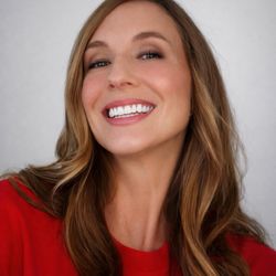 Ahn Dental Specialists - Happy patient showing her restored smile after prosthodontic care.