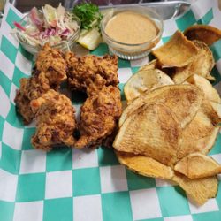 Conch fritters, fresh made chips and citrus slaw