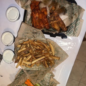 Wingstop - 24pc Family Pack (hot wings and hot honey rub), Seasoned Fries, and Veggie Sticks - Chicken Wings Near Me - Bronx, New York