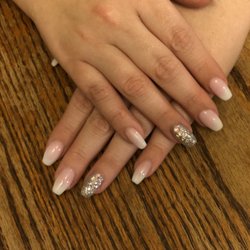 Blue And Pink Nail Spa - Pink and white ombré with gems as an accent nail.